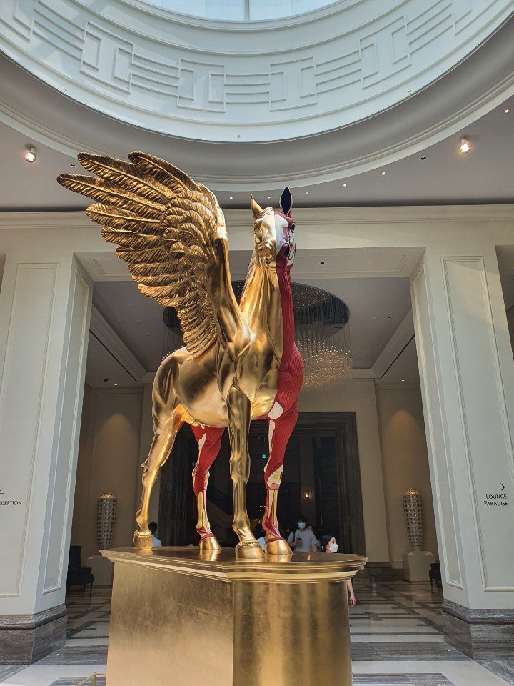 Damien Hirst Golden Legend, a golden winged horse, in the Paradise City lobby