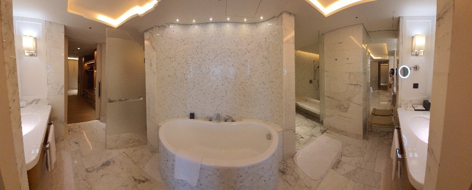 Suite bathroom with a bathtub at Paradise City