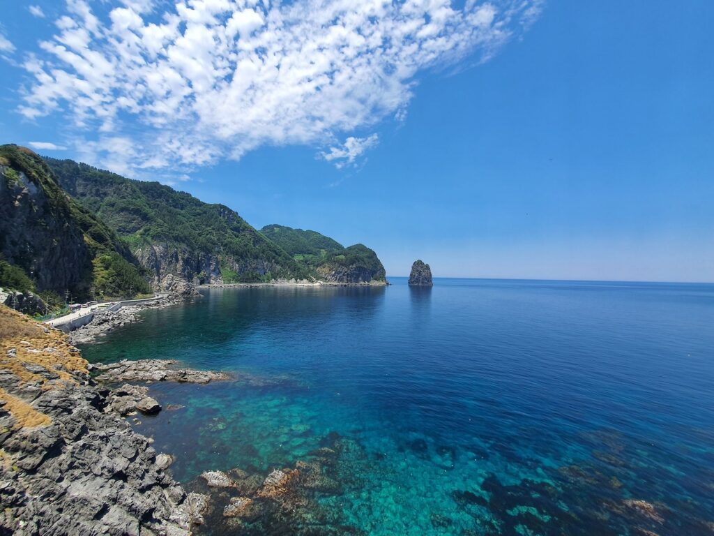 Clear turquoise water in a calm swimming cove on Ulleungdo
