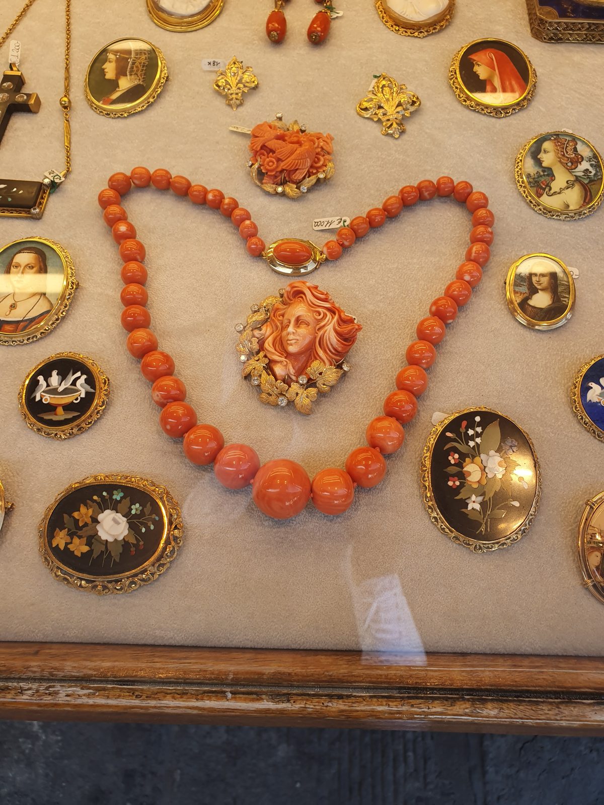 Coral necklace and antique brooches in a Ponte Vecchio jewelry shop