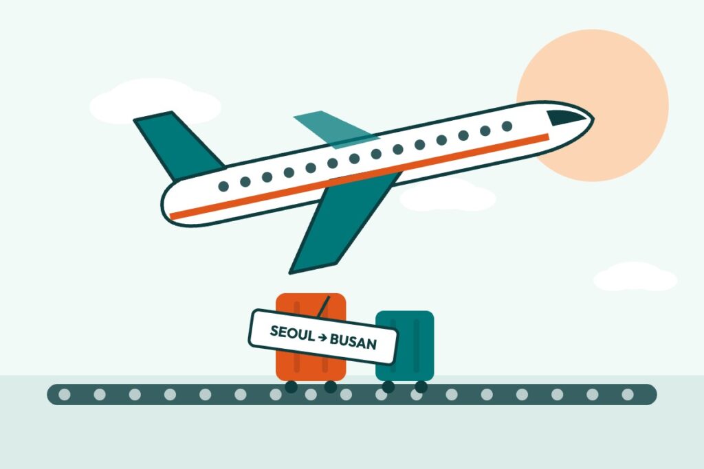 Plane and a checked suitcase tagged Seoul to Busan on a luggage belt