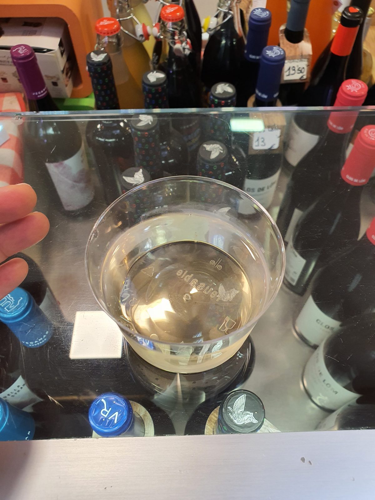 A glass of white wine at a stall in Mercado Central, Valencia