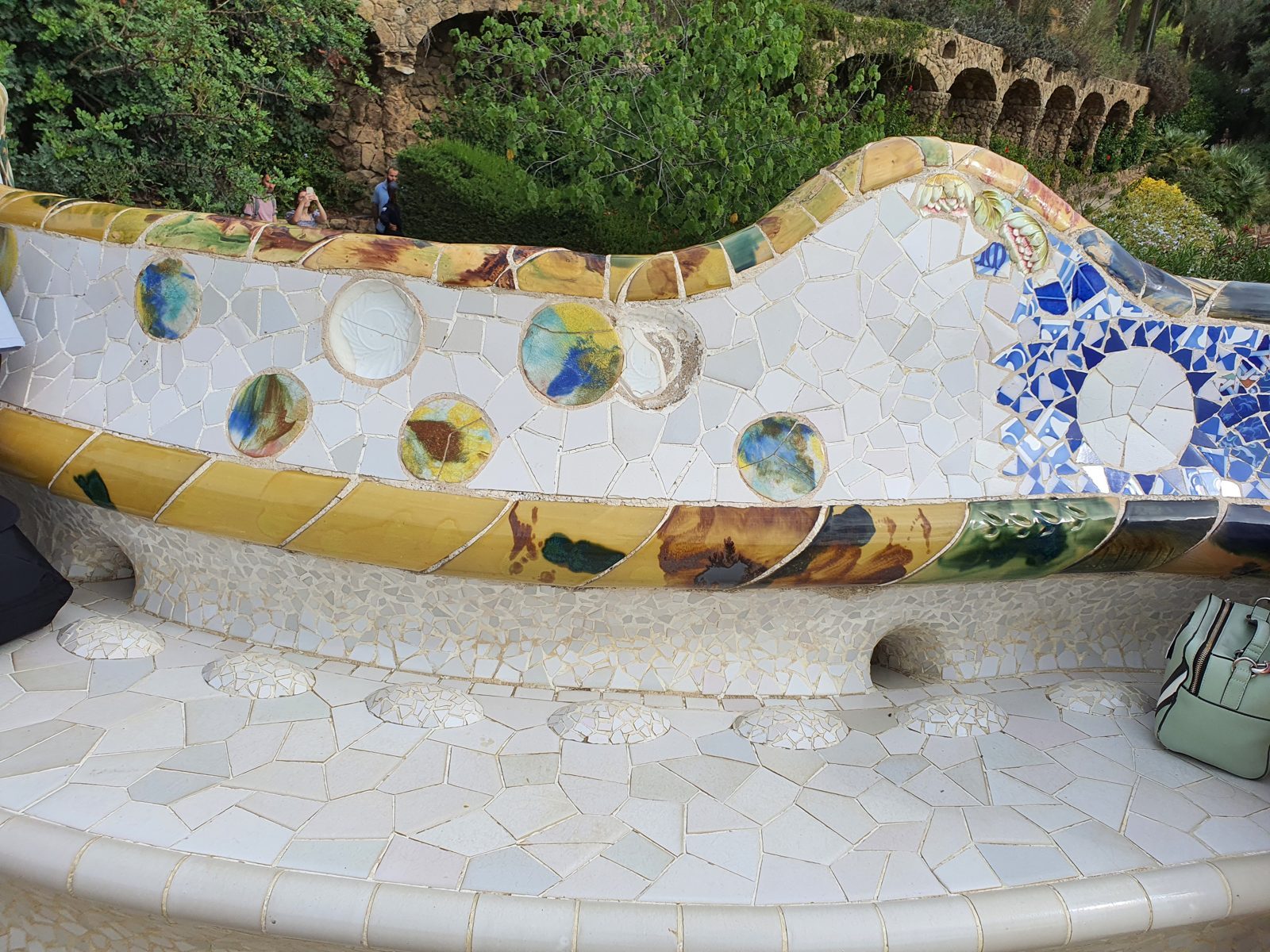 Mosaic tiles on the long bench at Park Güell