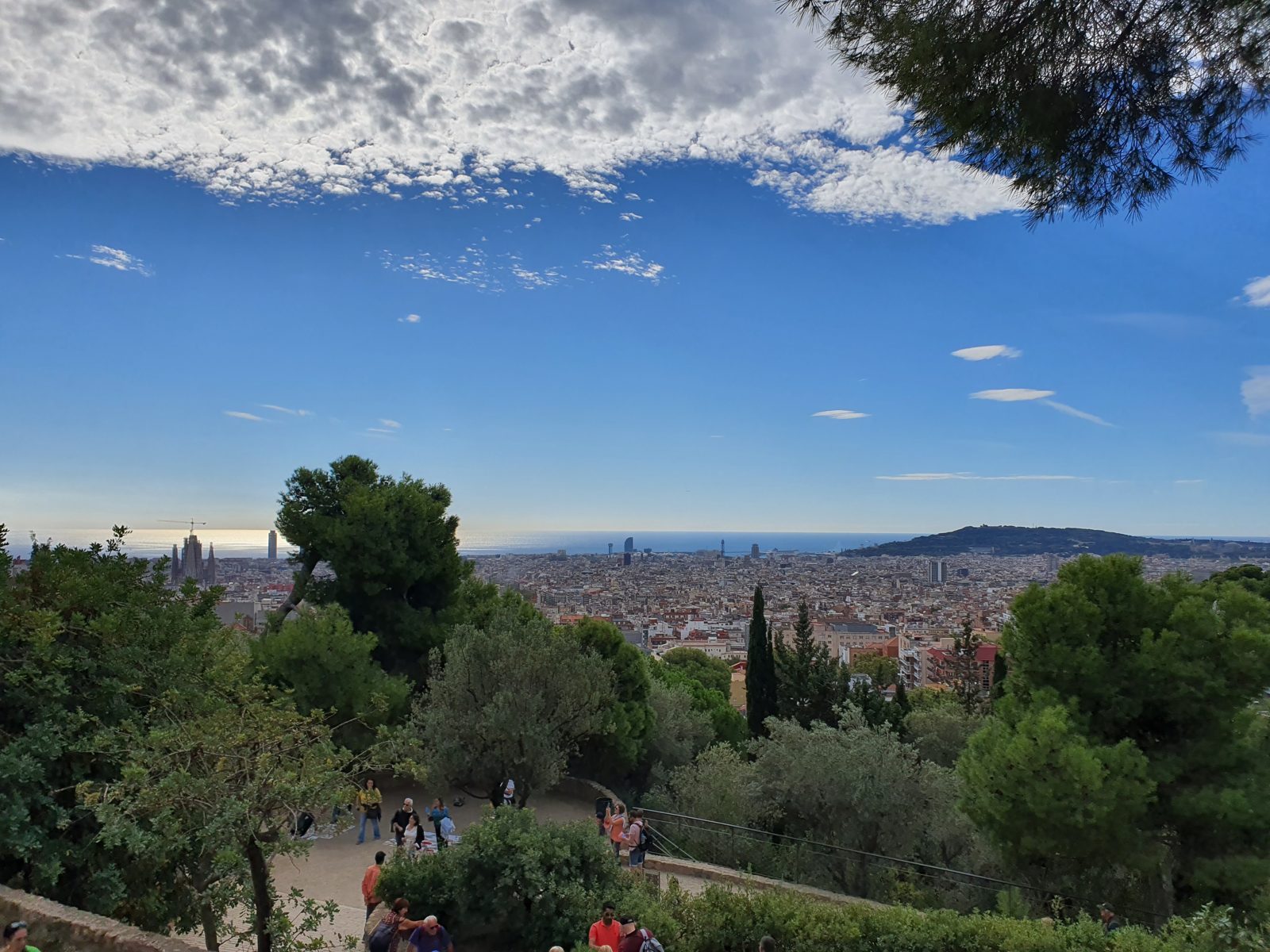 View from Park Güell over Barcelona, with the Sagrada Família and the sea on the horizon