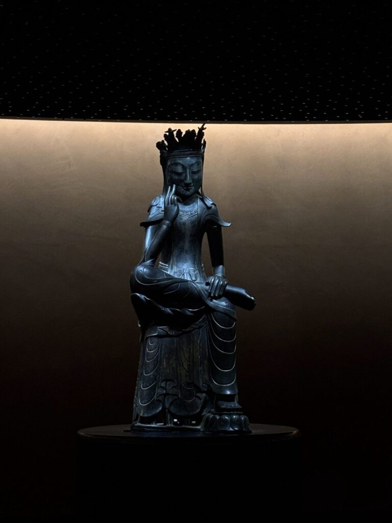 Pensive Bodhisattva with a tall crown in the Room of Quiet Contemplation