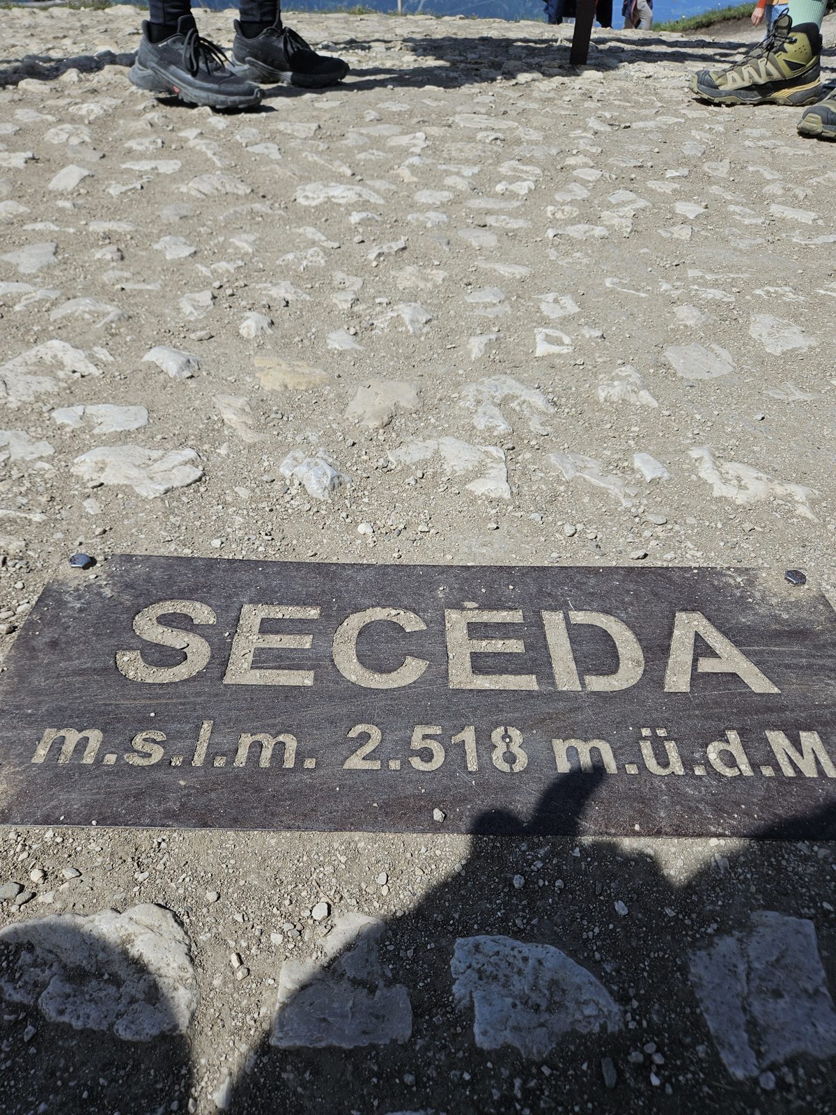Seceda summit marker in the ground, 2,518 metres