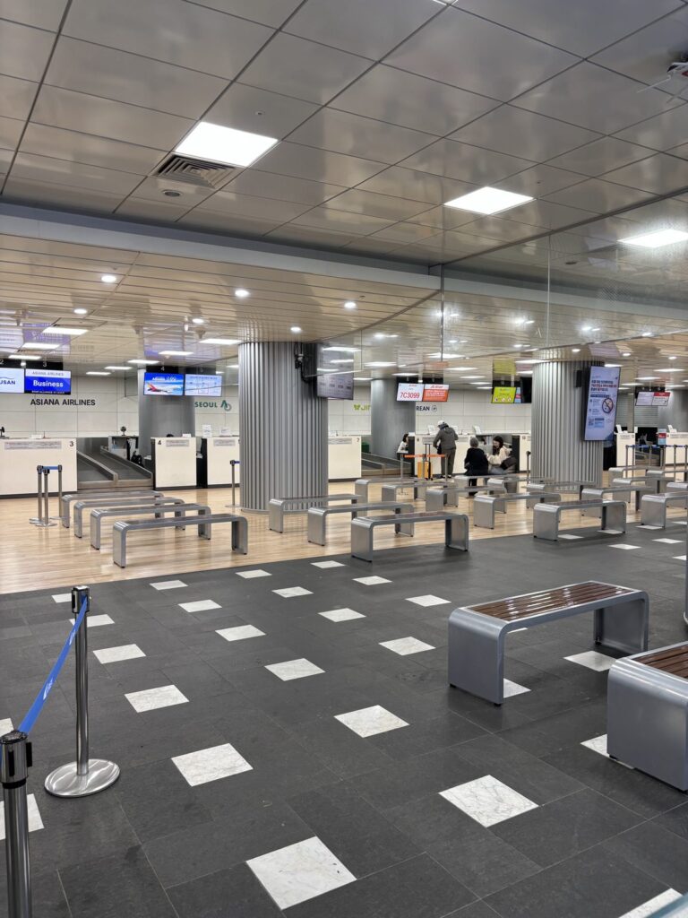 Asiana, Jeju Air and Jin Air check-in counters at Seoul Station, nearly empty